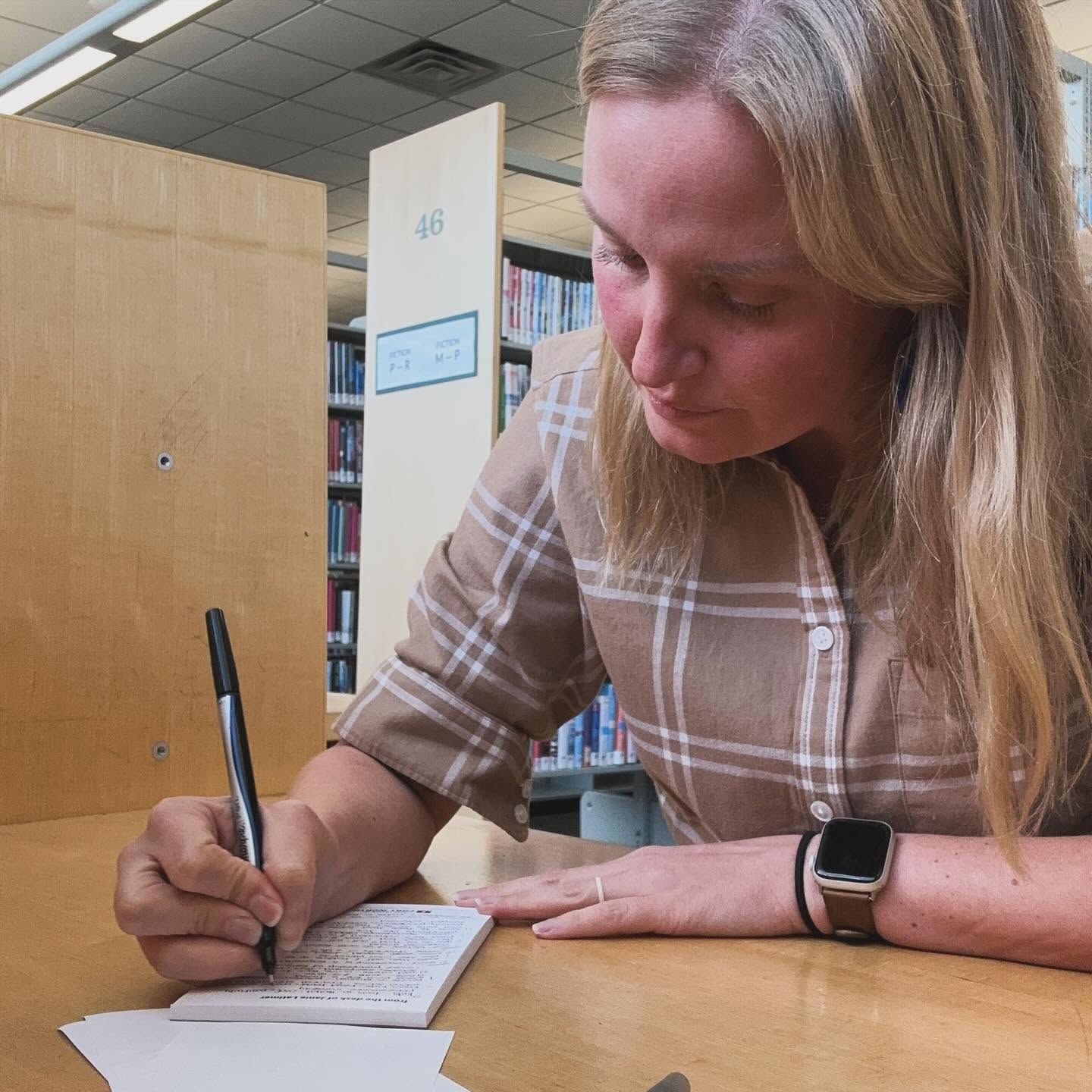 Janie writing a handwritten note